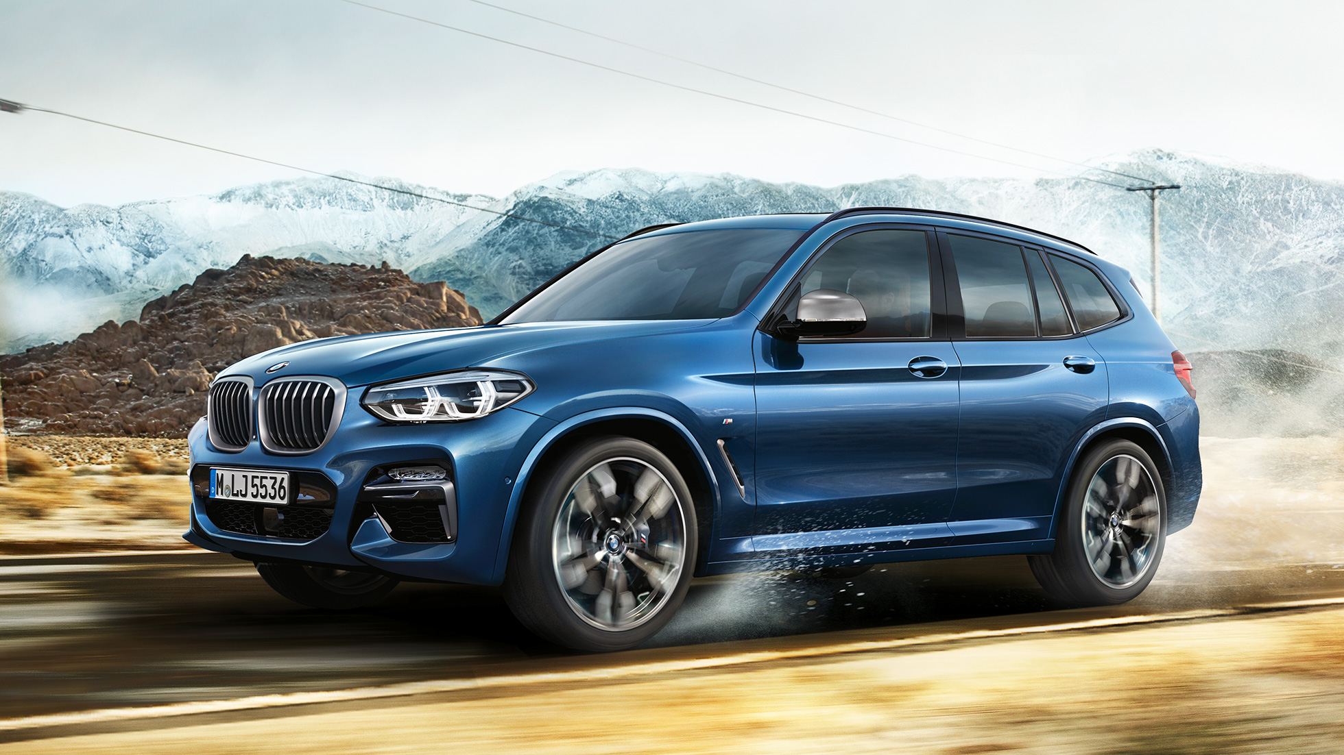 BMW X3 M40i, Halbtotale Felge und Kotflügel vor Gebirge BMW X3 M40i, Halbtotale Felge und Kotflügel vor Gebirge